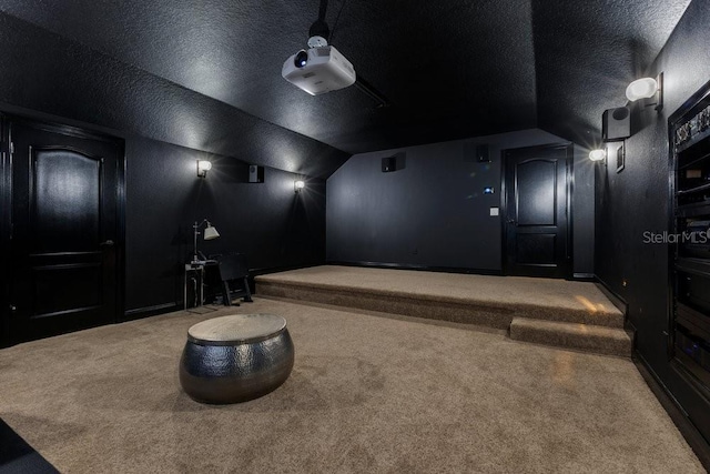 6761 Valhalla Way, Windermere, FL 34786 - carpeted home theater room with lofted ceiling and a textured ceiling