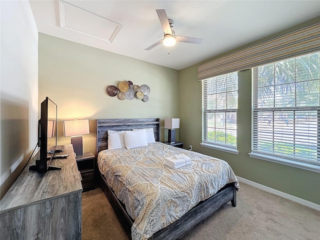 1614 Lima Ave, Kissimmee, FL 34747 - carpeted bedroom with attic access, baseboards, and a ceiling fan
