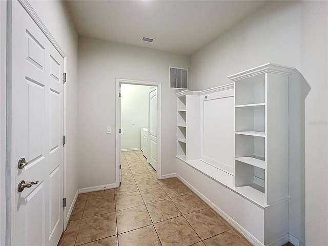 1614 Lima Ave, Kissimmee, FL 34747 - mudroom with light tile patterned floors and baseboards