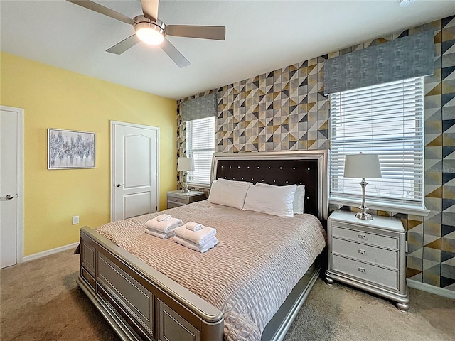 1614 Lima Ave, Kissimmee, FL 34747 - bedroom featuring carpet, an accent wall, baseboards, and a ceiling fan
