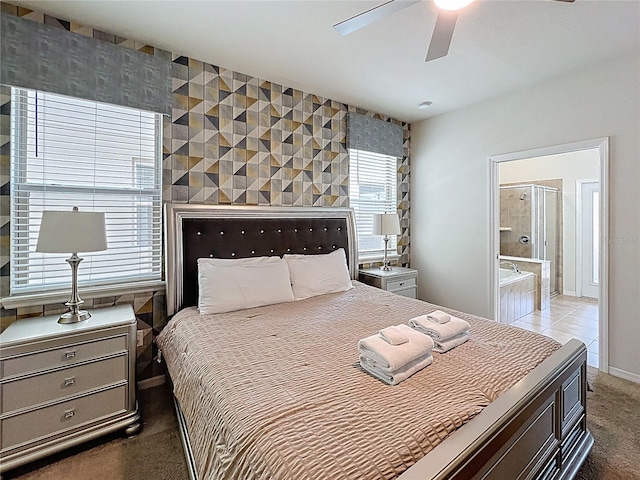 1614 Lima Ave, Kissimmee, FL 34747 - bedroom featuring an accent wall, connected bathroom, ceiling fan, and carpet flooring