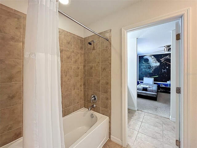1614 Lima Ave, Kissimmee, FL 34747 - bathroom with shower / bath combination with curtain, baseboards, and tile patterned floors