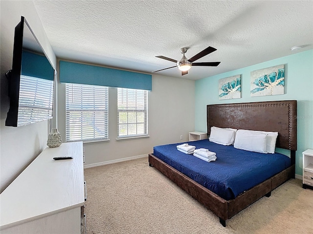 1614 Lima Ave, Kissimmee, FL 34747 - carpeted bedroom with a ceiling fan, baseboards, and a textured ceiling