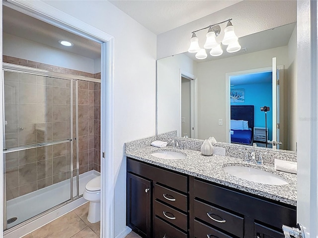 1614 Lima Ave, Kissimmee, FL 34747 - bathroom with tile patterned floors, toilet, a shower stall, and ensuite bathroom