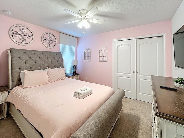 1614 Lima Ave, Kissimmee, FL 34747 - bedroom with carpet floors, a closet, ceiling fan, and a textured ceiling