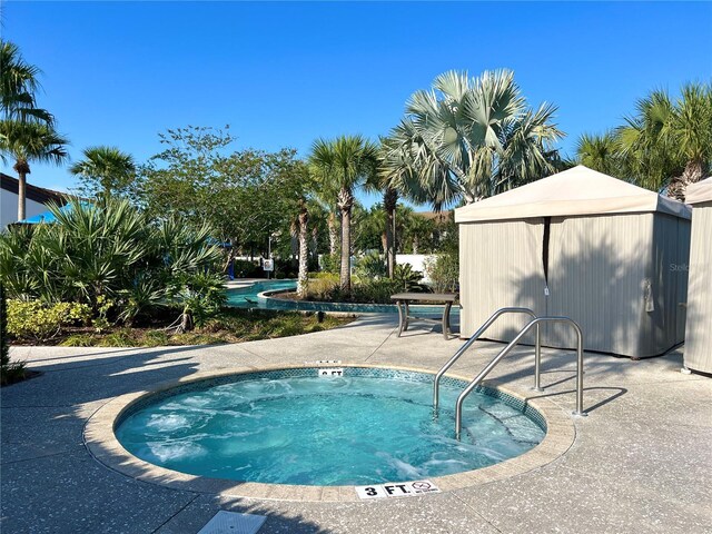 1614 Lima Ave, Kissimmee, FL 34747 - view of swimming pool featuring a hot tub