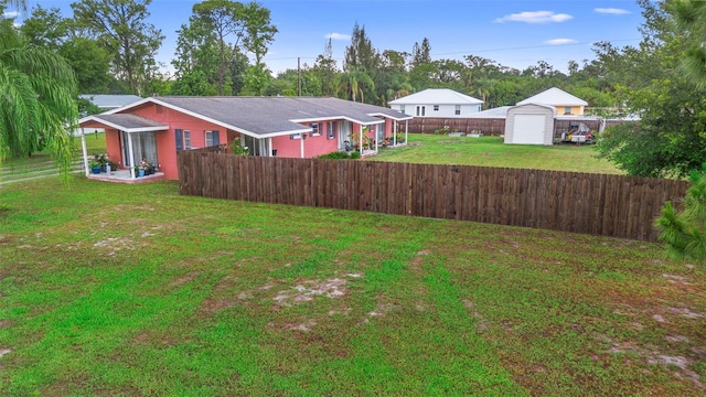 303 Thrush Ave, Sebring, FL 33870 - view of yard featuring an outdoor structure, a storage shed, and a detached garage