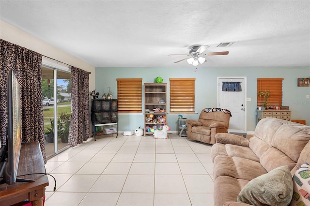 303 Thrush Ave, Sebring, FL 33870 - tiled living area with ceiling fan and baseboards