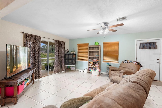 303 Thrush Ave, Sebring, FL 33870 - tiled living room with a ceiling fan and baseboards