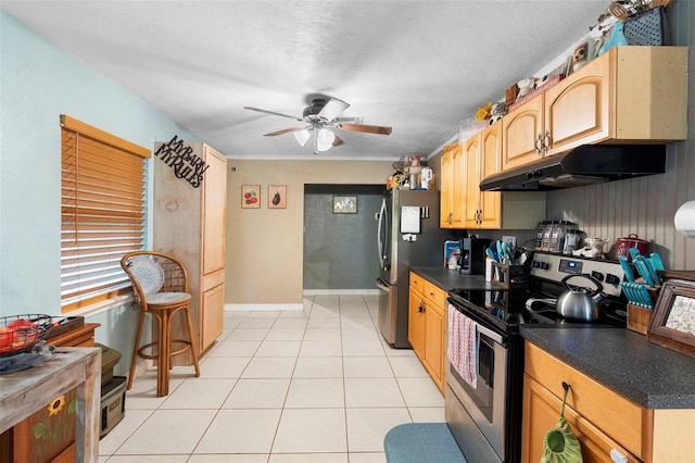 303 Thrush Ave, Sebring, FL 33870 - kitchen featuring appliances with stainless steel finishes, under cabinet range hood, ceiling fan, and dark countertops