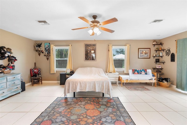 303 Thrush Ave, Sebring, FL 33870 - bedroom featuring multiple windows, light tile patterned floors, baseboards, and ceiling fan