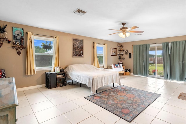 303 Thrush Ave, Sebring, FL 33870 - bedroom featuring baseboards, a ceiling fan, and light tile patterned floors