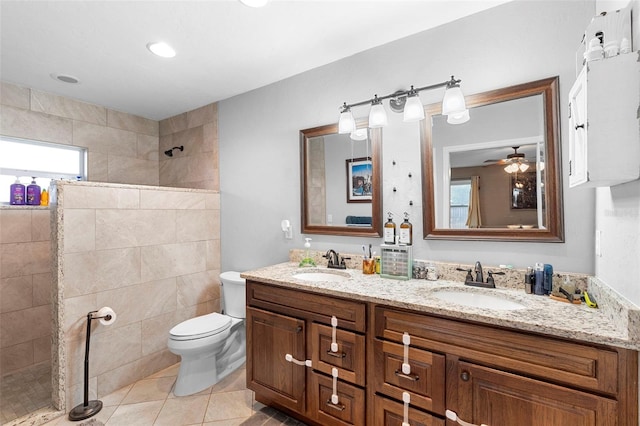 303 Thrush Ave, Sebring, FL 33870 - bathroom featuring a walk in shower, tile patterned floors, toilet, double vanity, and ceiling fan