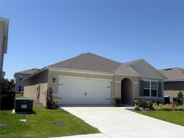 2569 Trinidad Rd, Haines City, FL 33844 - single story home with an attached garage, stucco siding, concrete driveway, and a front lawn