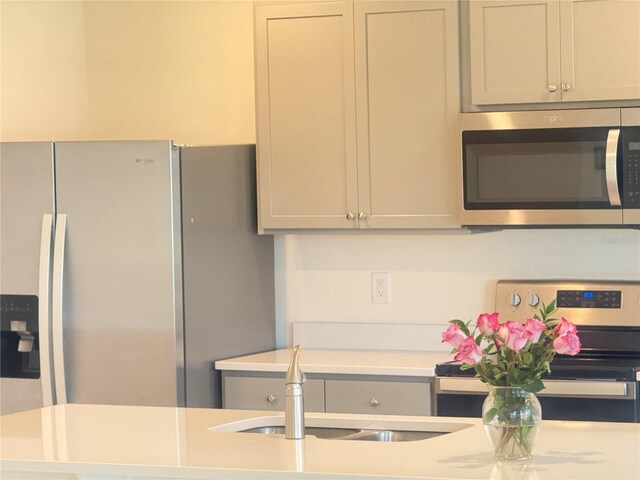 2569 Trinidad Rd, Haines City, FL 33844 - kitchen with stainless steel appliances, light countertops, and a sink