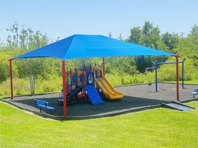 2569 Trinidad Rd, Haines City, FL 33844 - community jungle gym featuring a lawn