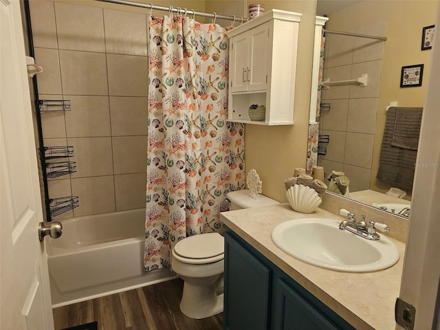 bathroom with wood finished floors, shower / bath combination with curtain, toilet, and vanity