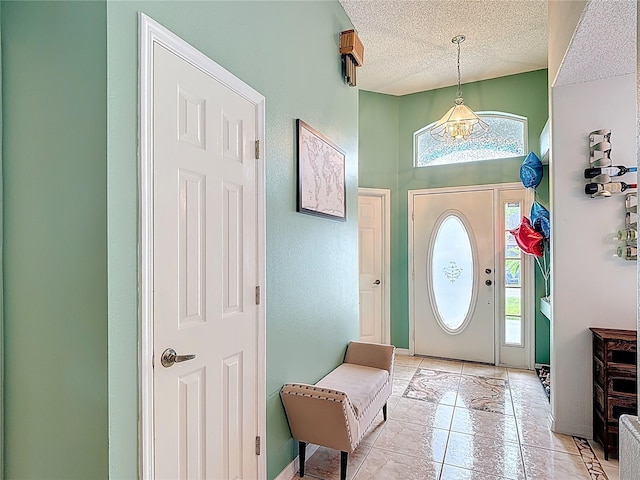 12445 Bohannon Blvd, Orlando, FL 32824 - entryway with a textured ceiling and light tile patterned floors