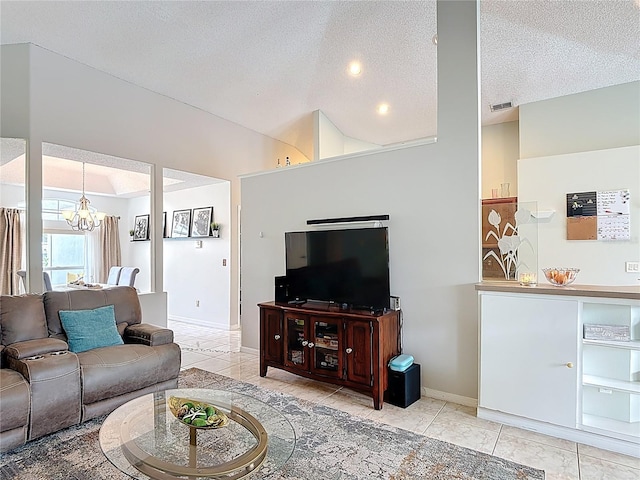 12445 Bohannon Blvd, Orlando, FL 32824 - living room featuring a chandelier, tile patterned flooring, a textured ceiling, and baseboards