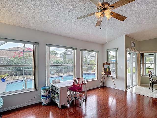 12445 Bohannon Blvd, Orlando, FL 32824 - office with a textured ceiling, wood finished floors, a ceiling fan, baseboards, and lofted ceiling