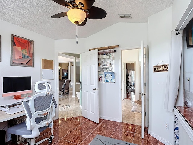 12445 Bohannon Blvd, Orlando, FL 32824 - office area featuring a textured ceiling, ceiling fan, lofted ceiling, baseboards, and dark tile patterned flooring