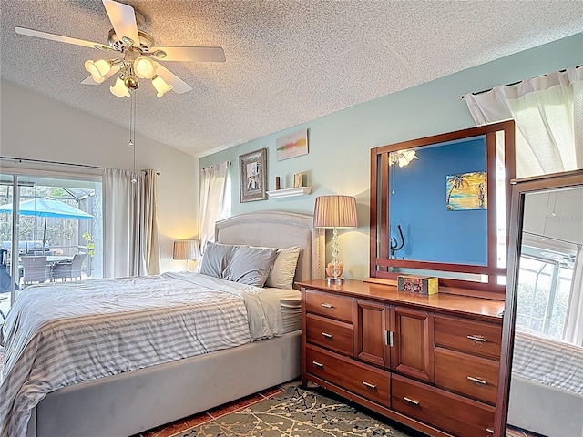 12445 Bohannon Blvd, Orlando, FL 32824 - bedroom featuring a textured ceiling, vaulted ceiling, a ceiling fan, and access to exterior
