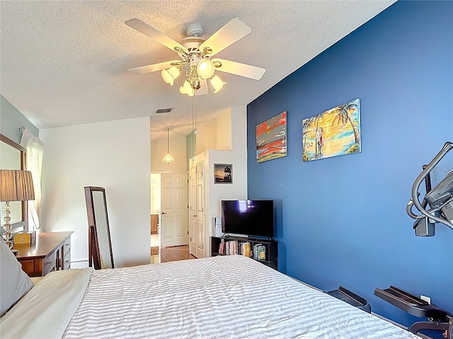 12445 Bohannon Blvd, Orlando, FL 32824 - bedroom with a textured ceiling and ceiling fan