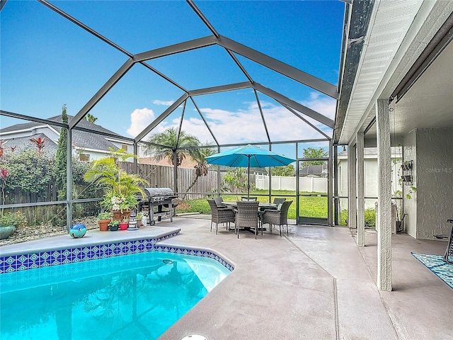 12445 Bohannon Blvd, Orlando, FL 32824 - view of swimming pool with a fenced backyard, a patio area, area for grilling, and a lanai
