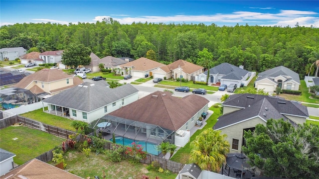 12445 Bohannon Blvd, Orlando, FL 32824 - aerial perspective of suburban area with a pool area and a heavily wooded area