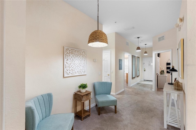sitting room with carpet flooring and baseboards