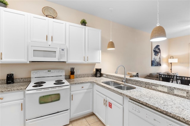 kitchen with white appliances, a sink, white cabinetry, and pendant lighting