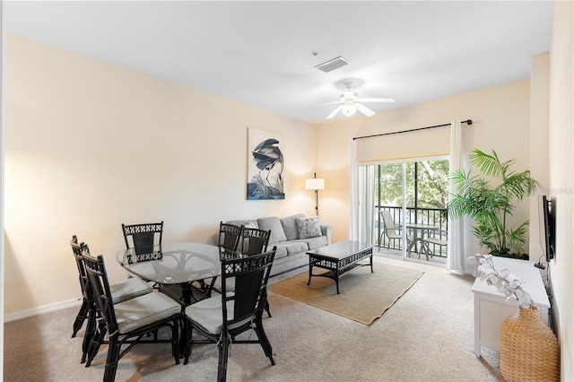 dining space with carpet floors, ceiling fan, and baseboards