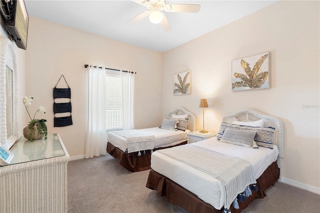 bedroom featuring carpet floors, baseboards, and ceiling fan