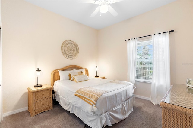 bedroom with carpet floors, baseboards, and ceiling fan