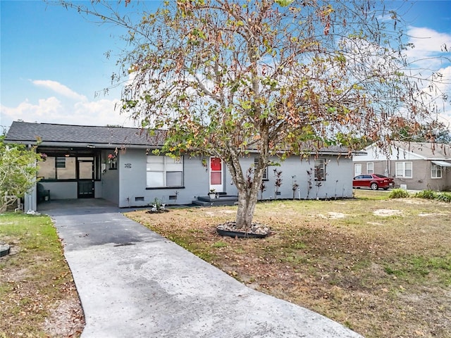 320 S Seminole Ave, Lake Alfred, FL 33850 - ranch-style home with a carport, driveway, roof with shingles, and a front yard