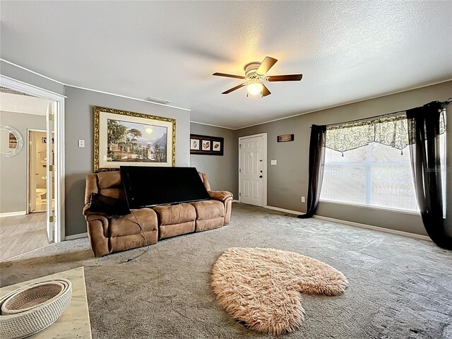 320 S Seminole Ave, Lake Alfred, FL 33850 - carpeted living area with ceiling fan and baseboards