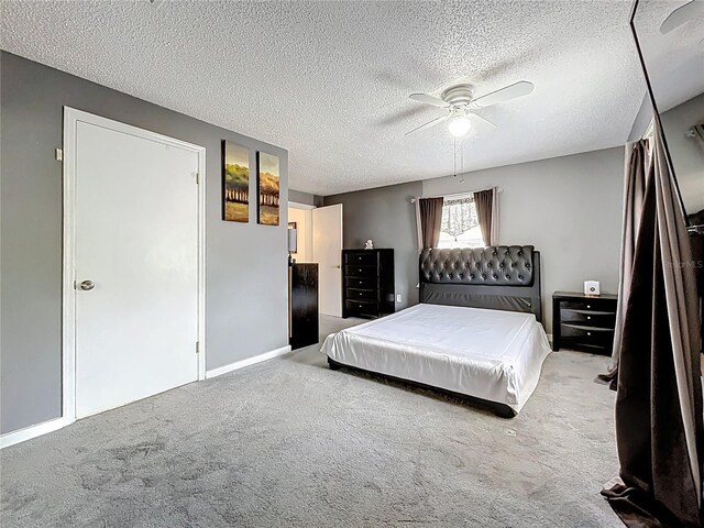 320 S Seminole Ave, Lake Alfred, FL 33850 - bedroom featuring carpet flooring, a textured ceiling, a ceiling fan, and baseboards