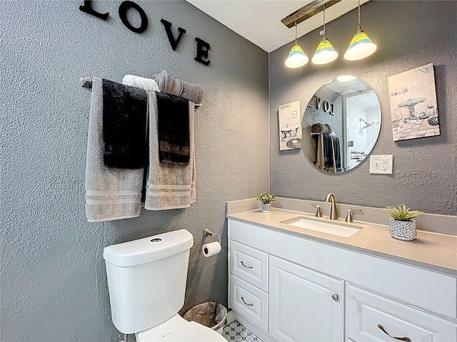 320 S Seminole Ave, Lake Alfred, FL 33850 - bathroom with toilet, vanity, and a textured wall