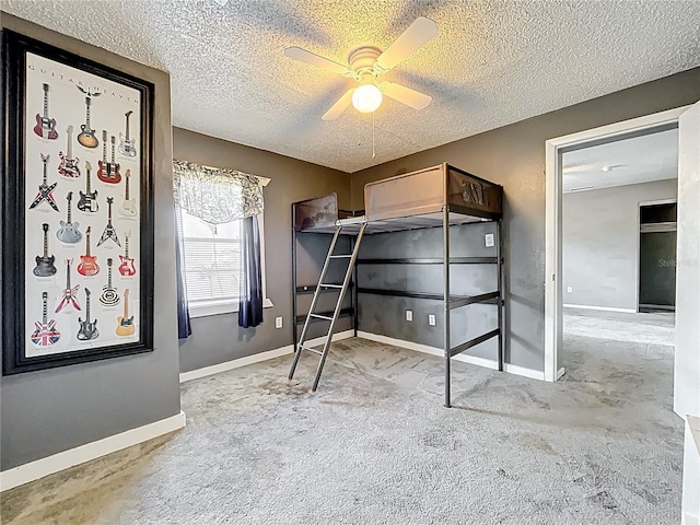 320 S Seminole Ave, Lake Alfred, FL 33850 - unfurnished bedroom featuring carpet, a textured ceiling, a ceiling fan, and baseboards