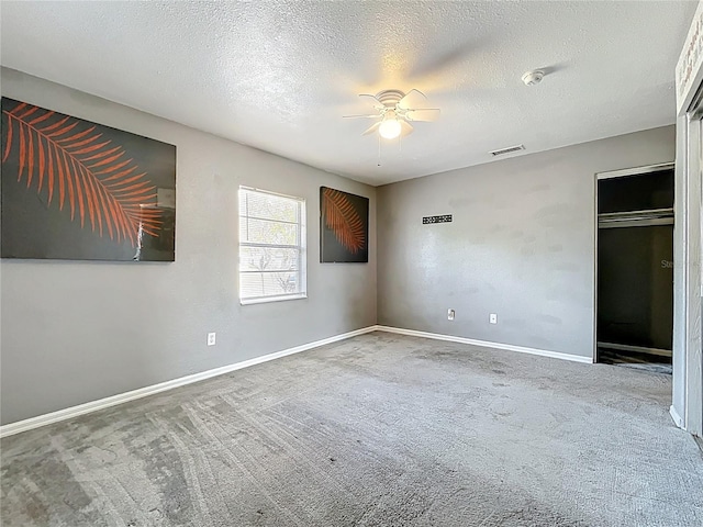 320 S Seminole Ave, Lake Alfred, FL 33850 - unfurnished bedroom featuring carpet flooring, baseboards, a textured ceiling, and ceiling fan