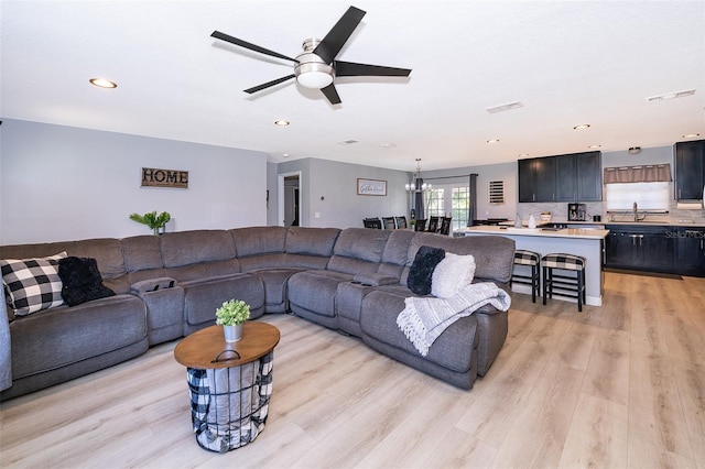 1730 Carolyn Ct, Saint Cloud, FL 34769 - living room with ceiling fan, light wood-style flooring, recessed lighting, and a chandelier