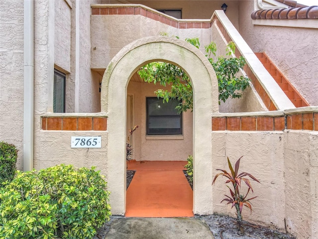 7865 Sugar View Ct Unit 7865, Orlando, FL 32819 - view of exterior entry featuring stucco siding
