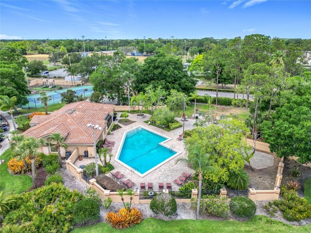 7865 Sugar View Ct Unit 7865, Orlando, FL 32819 - drone / aerial view of a pool and a tree filled landscape