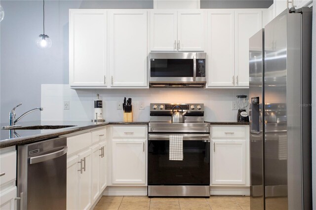 3181 Tocoa Cir, Kissimmee, FL 34746 - kitchen featuring appliances with stainless steel finishes, a sink, and white cabinetry