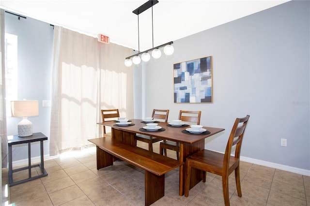 3181 Tocoa Cir, Kissimmee, FL 34746 - dining room featuring light tile patterned flooring and baseboards