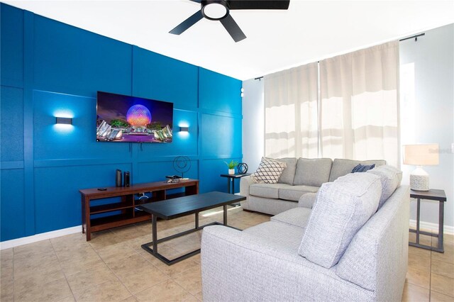 3181 Tocoa Cir, Kissimmee, FL 34746 - living area with ceiling fan, light tile patterned flooring, and baseboards