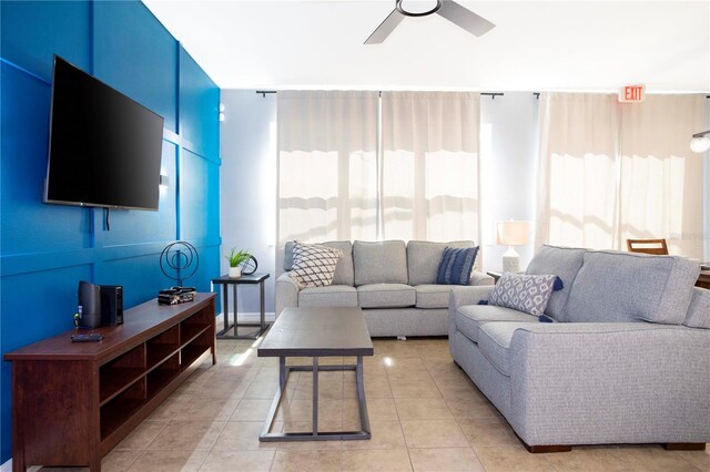3181 Tocoa Cir, Kissimmee, FL 34746 - living room featuring ceiling fan and light tile patterned floors