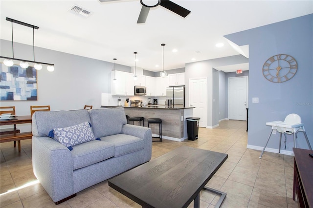 3181 Tocoa Cir, Kissimmee, FL 34746 - living room featuring ceiling fan, light tile patterned flooring, recessed lighting, and baseboards