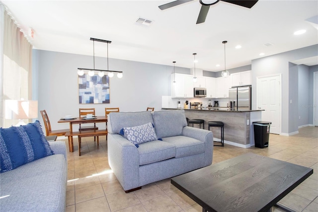 3181 Tocoa Cir, Kissimmee, FL 34746 - living room with light tile patterned flooring, ceiling fan, recessed lighting, and baseboards