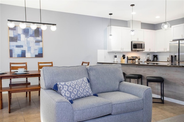 3181 Tocoa Cir, Kissimmee, FL 34746 - living room featuring light tile patterned flooring and recessed lighting